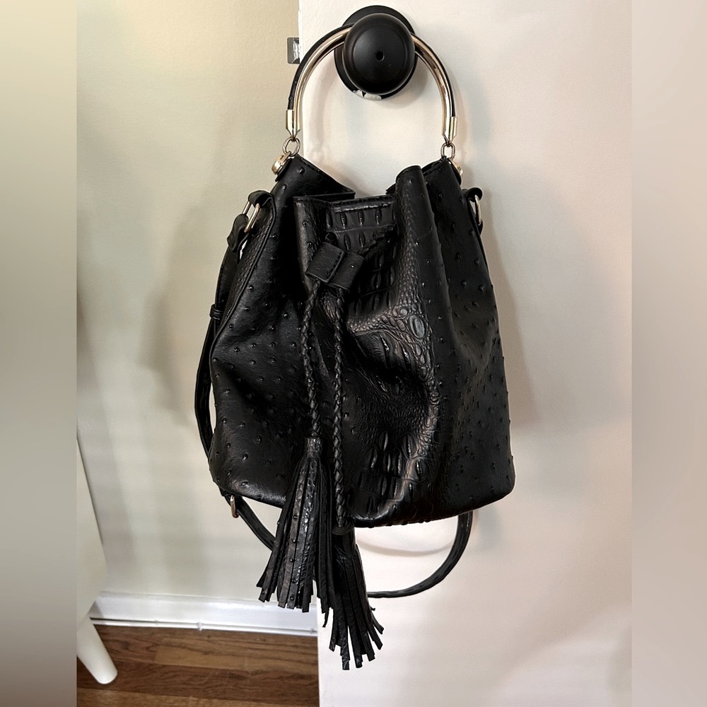 Vegan leather tasseled drawstring purse with gold hardware